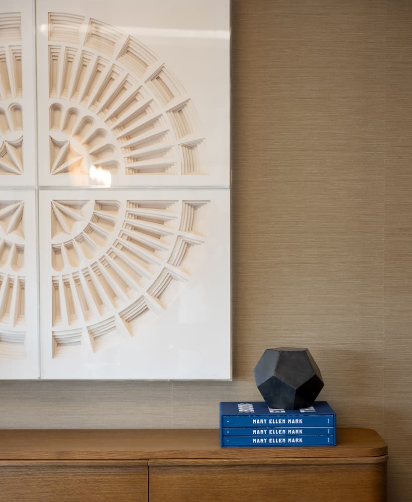 Curated wall art and decor on a credenza at the Fairfax Title office in Preston Center